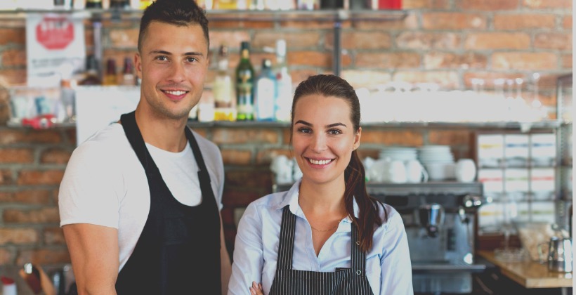 young-man-and-woman-working-at-cafe-picture-id807295236-2